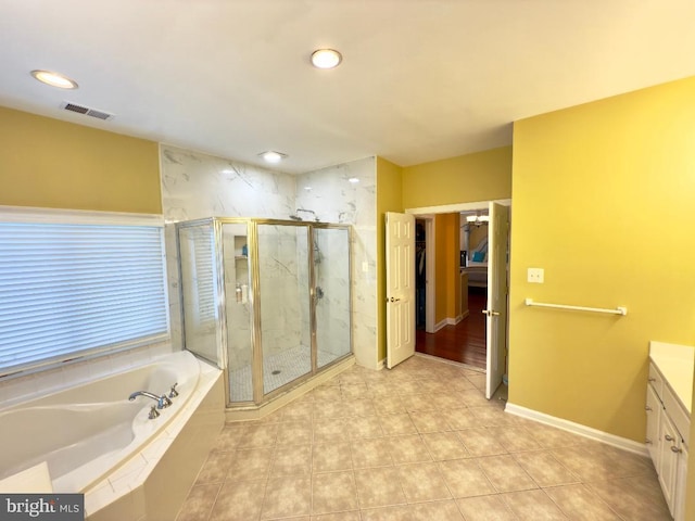 3701 Spicebush Way, Frederick, MD 21704 - full bathroom featuring vanity, a garden tub, a marble finish shower, tile patterned floors, and recessed lighting