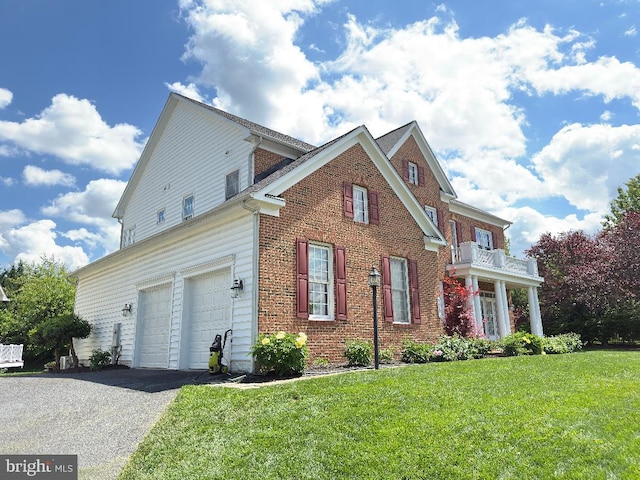 3701 Spicebush Way, Frederick, MD 21704 - view of side of property with asphalt driveway, a garage, a lawn, and brick siding