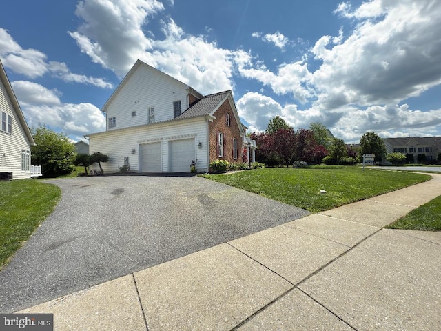3701 Spicebush Way, Frederick, MD 21704 - view of home's exterior featuring asphalt driveway, a lawn, brick siding, and a garage