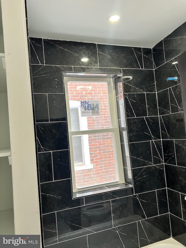 interior details with recessed lighting and walk in shower