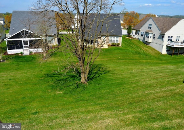 view of yard featuring a sunroom