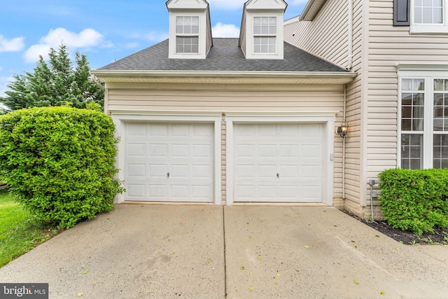 garage featuring driveway