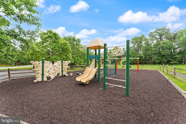 community jungle gym featuring fence