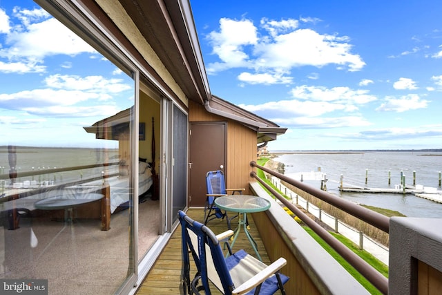 balcony featuring a water view