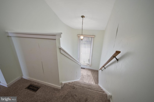 stairs with baseboards, visible vents, and carpet