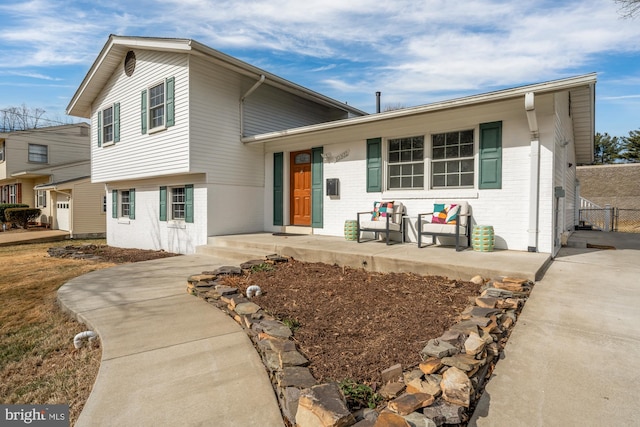tri-level home with brick siding