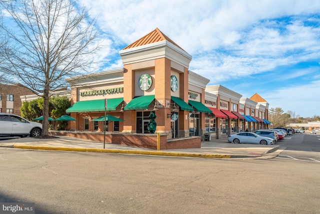 view of property featuring uncovered parking