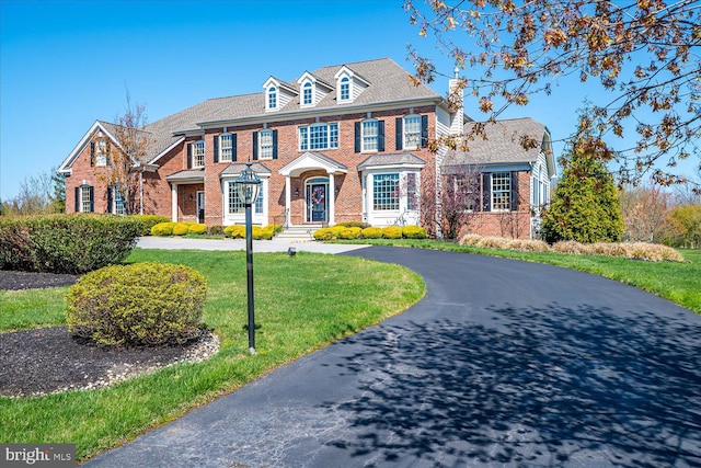 6 Ridgeview Way, Allentown, NJ 08501 - colonial-style house featuring brick siding, curved driveway, and a front yard