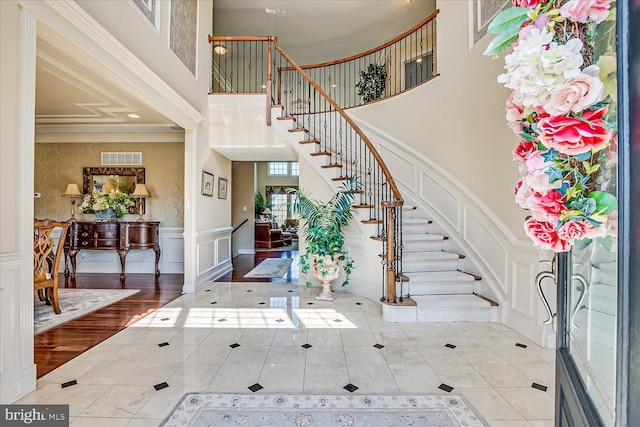 6 Ridgeview Way, Allentown, NJ 08501 - entrance foyer with stairway, tile patterned flooring, a towering ceiling, ornamental molding, and a decorative wall
