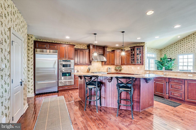 6 Ridgeview Way, Allentown, NJ 08501 - kitchen featuring wallpapered walls, a warming drawer, hardwood / wood-style floors, and appliances with stainless steel finishes