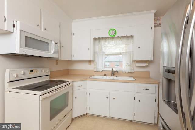 30 Cooper Ave, Marlton, NJ 08053 - kitchen with white cabinetry, a sink, white appliances, and light countertops