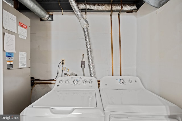 laundry room featuring washing machine and clothes dryer