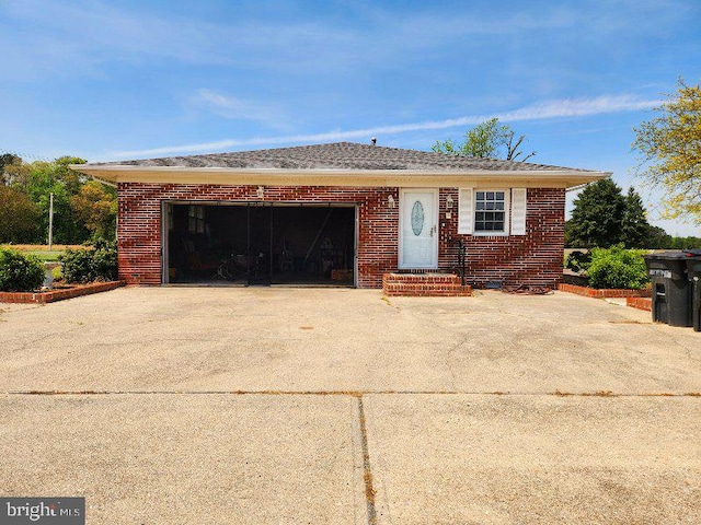 28964 Waller Rd, Delmar, MD 21875 - view of front facade featuring concrete driveway, brick siding, and a garage