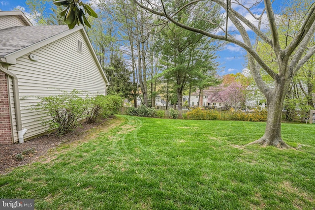 view of yard with fence