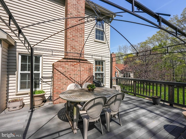 wooden deck with outdoor dining space