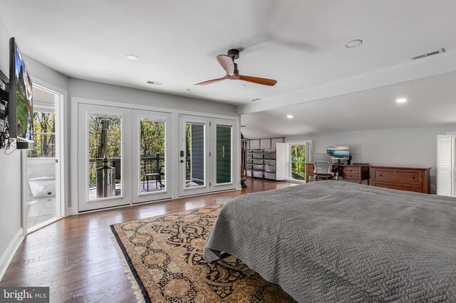 bedroom featuring wood finished floors, visible vents, and access to outside