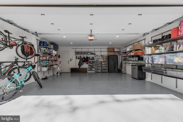 garage featuring recessed lighting and a garage door opener