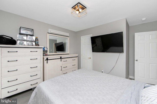 bedroom with wood finished floors