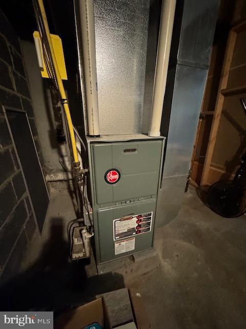 utility room with heating unit