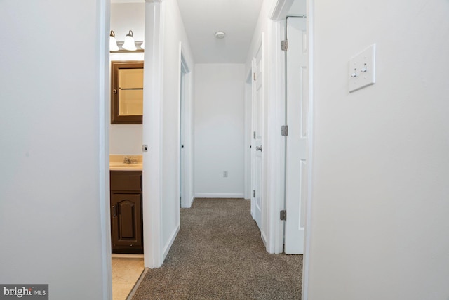13217 Gundale, Middle River, MD 21220 - hall featuring a sink, baseboards, and light colored carpet