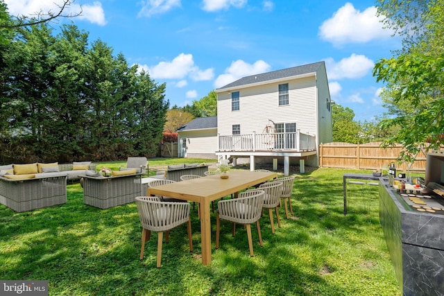 13217 Gundale, Middle River, MD 21220 - rear view of property with a fenced backyard, a lawn, a wooden deck, and an outdoor living space