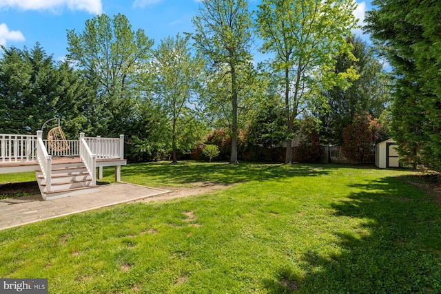 13217 Gundale, Middle River, MD 21220 - view of yard featuring an outdoor structure, fence, a deck, a patio, and a storage shed