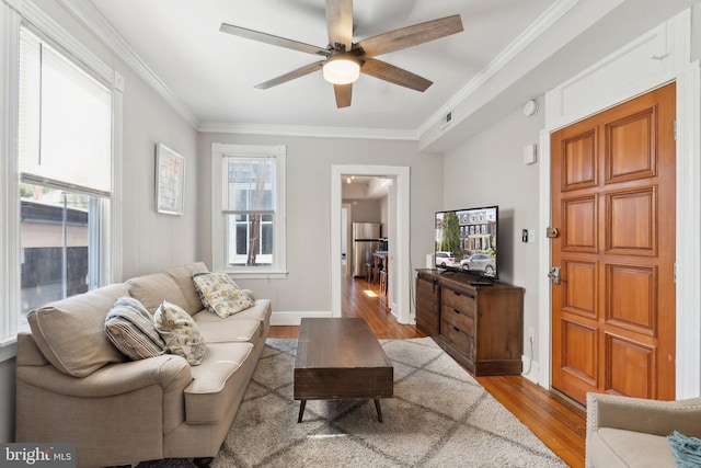 165 King George St, Annapolis, MD 21401 - living area with baseboards, visible vents, wood finished floors, ceiling fan, and ornamental molding