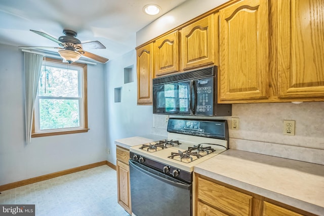 kitchen with black microwave, light countertops, gas range gas stove, a ceiling fan, and baseboards