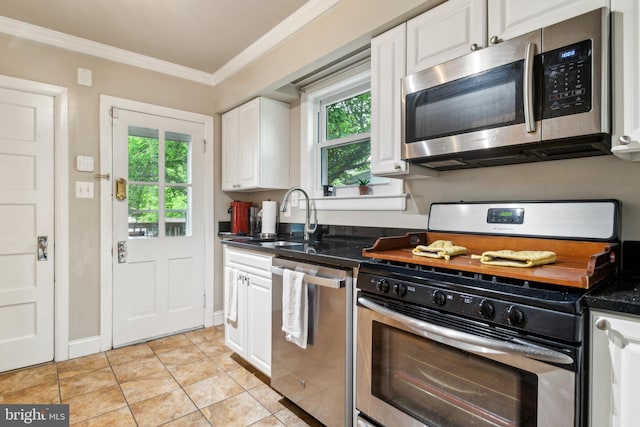 3330 Richmond Ave, Baltimore, MD 21213 - kitchen featuring stainless steel appliances, a sink, plenty of natural light, white cabinetry, and crown molding