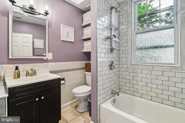 3330 Richmond Ave, Baltimore, MD 21213 - bathroom featuring toilet,  shower combination, vanity, tile walls, and tile patterned floors