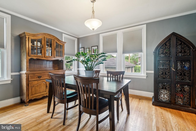 3330 Richmond Ave, Baltimore, MD 21213 - dining space featuring baseboards, light wood-style flooring, and ornamental molding