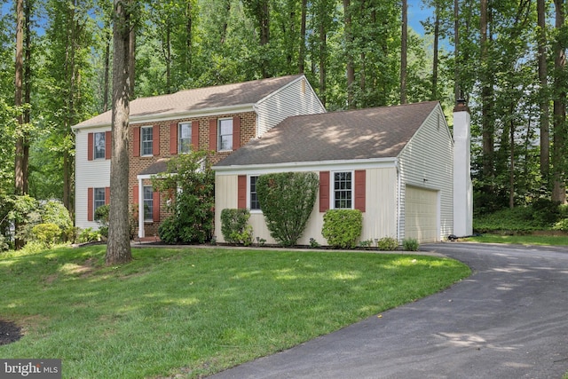 107 Timber Springs Ln, Exton, PA 19341 - colonial home featuring a chimney, a garage, a front lawn, driveway, and a shingled roof