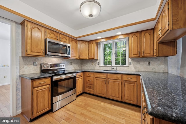 107 Timber Springs Ln, Exton, PA 19341 - kitchen with stainless steel appliances, light wood-type flooring, brown cabinetry, backsplash, and recessed lighting