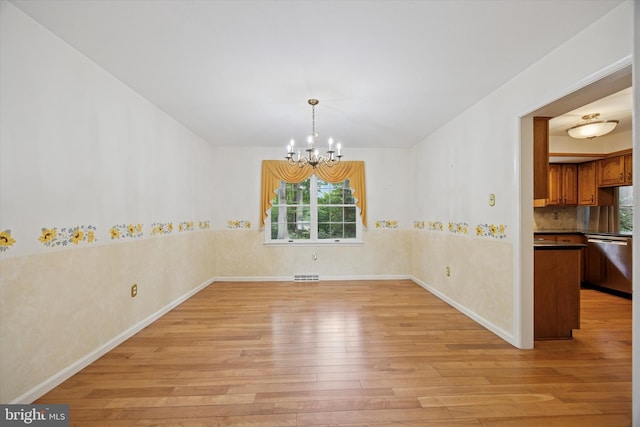 107 Timber Springs Ln, Exton, PA 19341 - unfurnished dining area featuring light wood-style floors and a chandelier