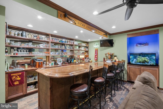 3211 Havenwood Ct, Edgewater, MD 21037 - indoor wet bar with ornamental molding, a ceiling fan, wood finished floors, and recessed lighting