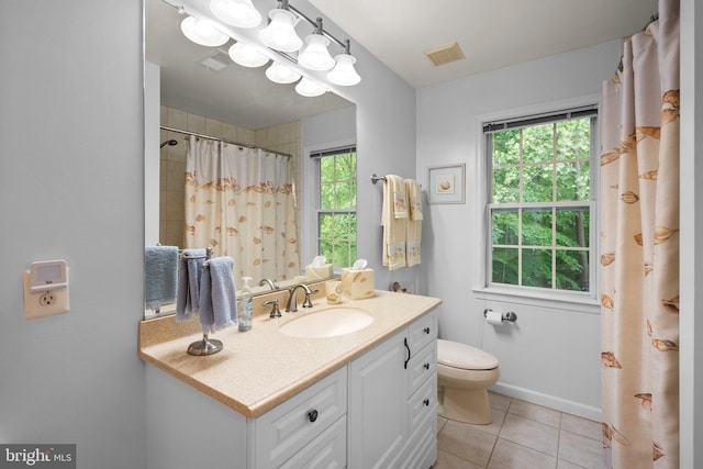 3211 Havenwood Ct, Edgewater, MD 21037 - bathroom with healthy amount of natural light, tile patterned flooring, toilet, and vanity
