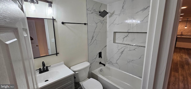 full bathroom featuring shower / bath combination, wood finished floors, vanity, and toilet