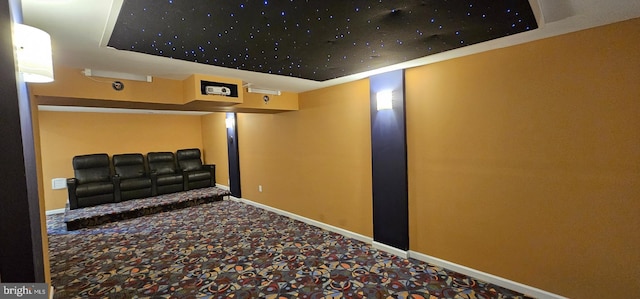 cinema featuring carpet floors and baseboards