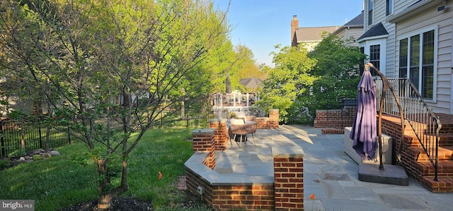 view of yard featuring a patio and fence