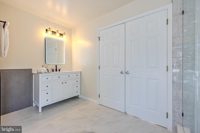 bathroom featuring tile patterned flooring and vanity