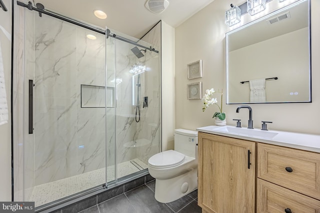 full bathroom with visible vents, toilet, vanity, and a marble finish shower