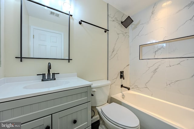 bathroom featuring toilet, visible vents, vanity, and shower / bath combination