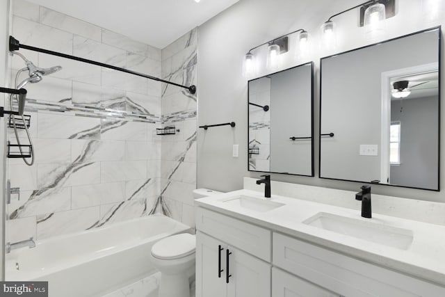 bathroom featuring a sink, double vanity, toilet, and shower / tub combination