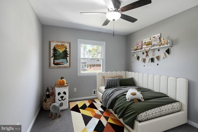 bedroom featuring baseboards and ceiling fan