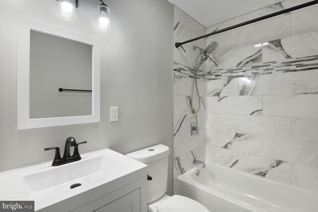 bathroom with vanity, bathing tub / shower combination, and toilet