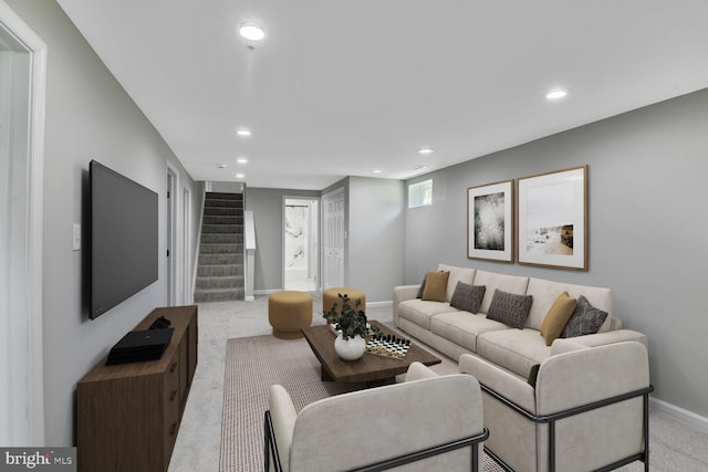 living room with recessed lighting, baseboards, light carpet, and stairway