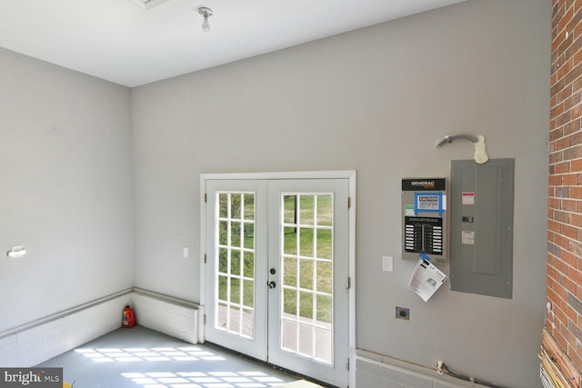 doorway with electric panel, french doors, and brick wall