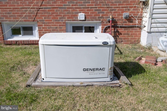 details featuring a power unit and brick siding