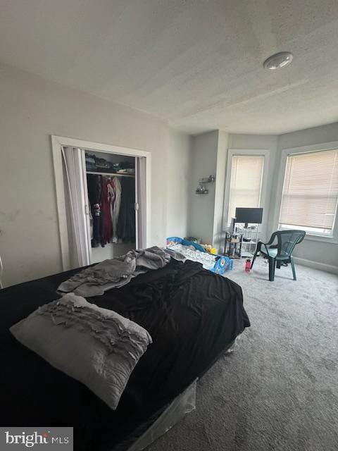 1341 E Rittenhouse St, Philadelphia, PA 19138 - carpeted bedroom with a textured ceiling and a closet