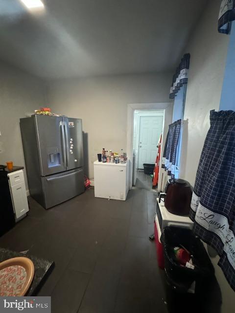 1341 E Rittenhouse St, Philadelphia, PA 19138 - kitchen featuring white cabinets and stainless steel refrigerator with ice dispenser